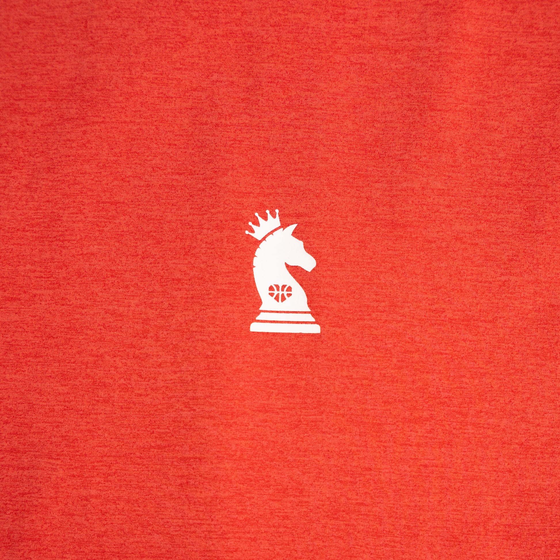 Red shirt with a white chess knight logo on a red background
