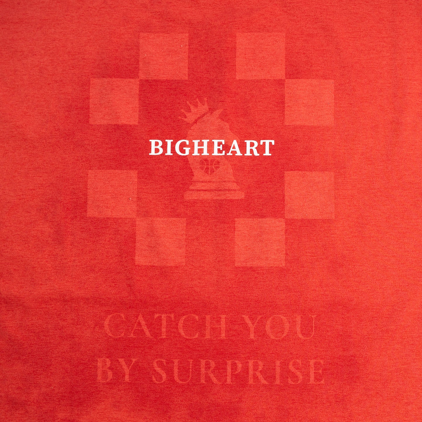 Red t-shirt with 'BIGHEART' logo and sweat activated artwork on a red background